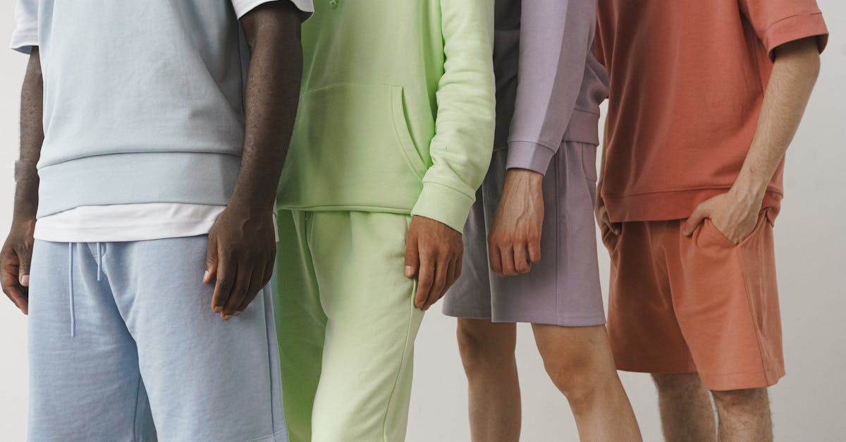 pexels-photo-9775877-9775877 A close-up image showcasing a variety of pastel-colored men's fashion sweatshirts and shorts.